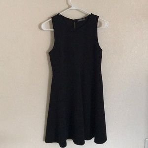 Black sleeveless dress.